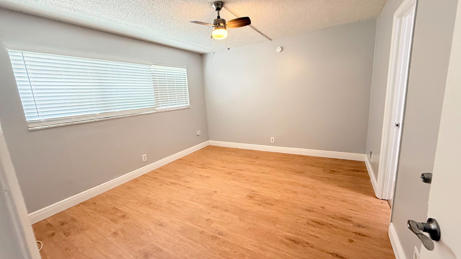 Bedroom with wood flooring