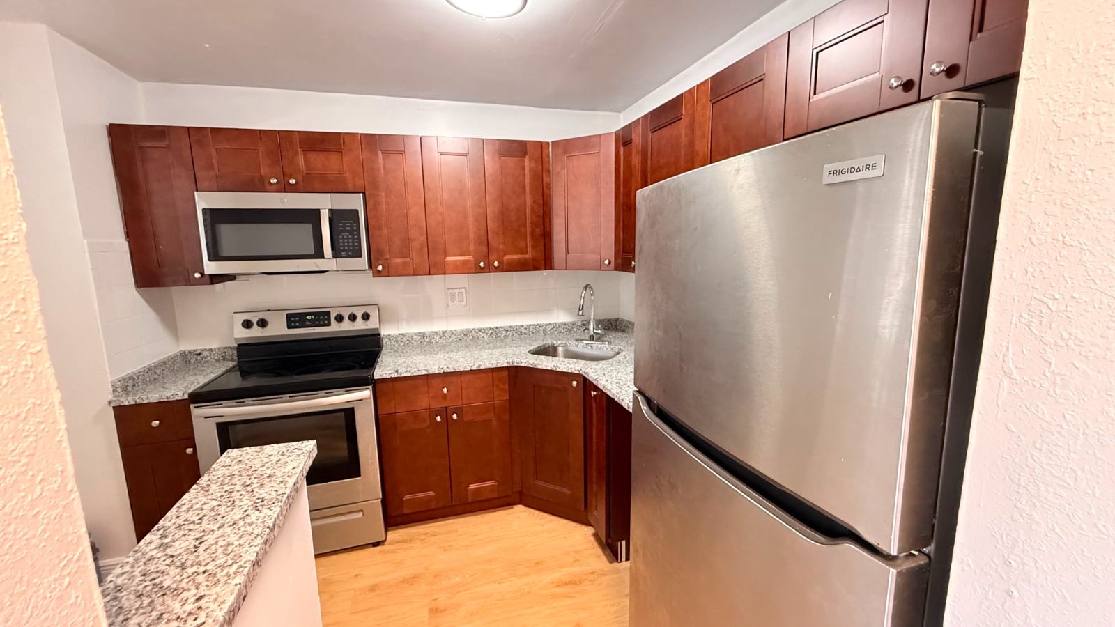 Renovated kitchen with granite and stainless